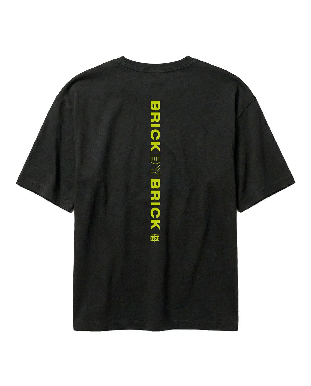 Brick by Brick oversize t-shirt in black — back with BRICK BY BRICK set vertically down the centre in lime green — Vista 1