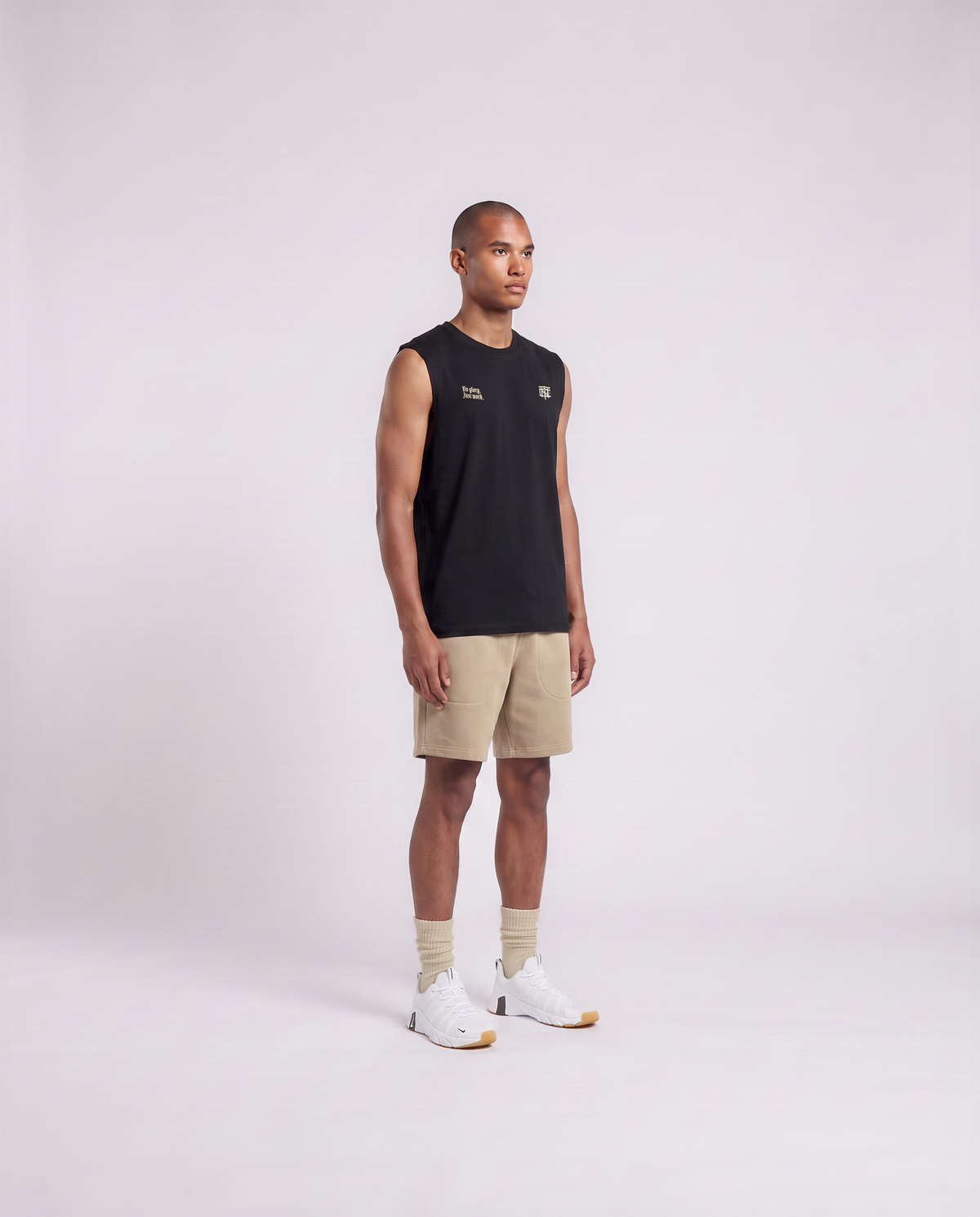 Model wearing the No Glory Just Work tank top in black — three-quarter view showing the regular fit — Ansicht 3
