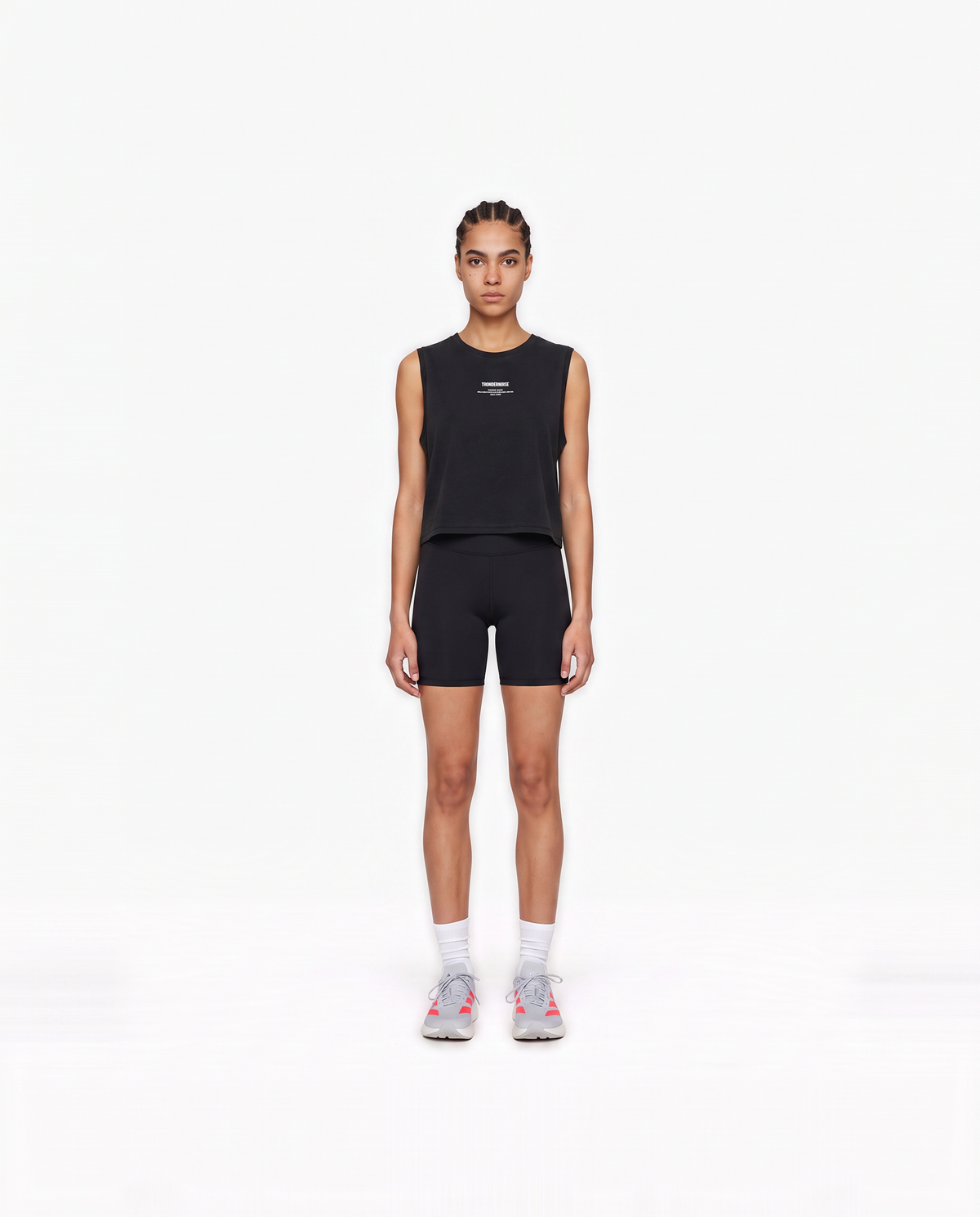 Model wearing the Today Was My Rest Day cropped tank top in black — front view with the compact Thundernoise chest mark in white — Vista 2