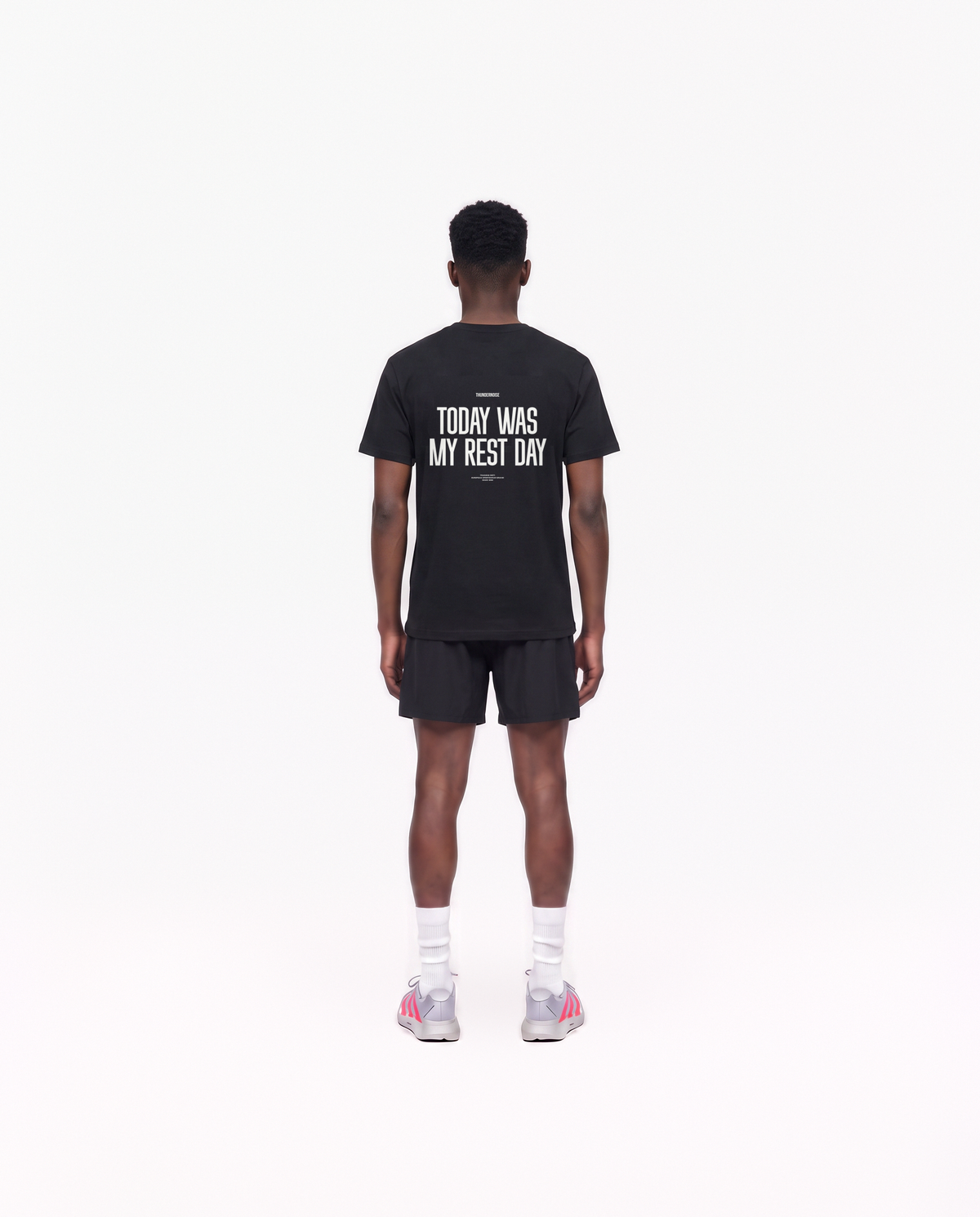 Model wearing the Today Was My Rest Day t-shirt in black — back view with the TODAY WAS MY REST DAY block in white — Vue 4