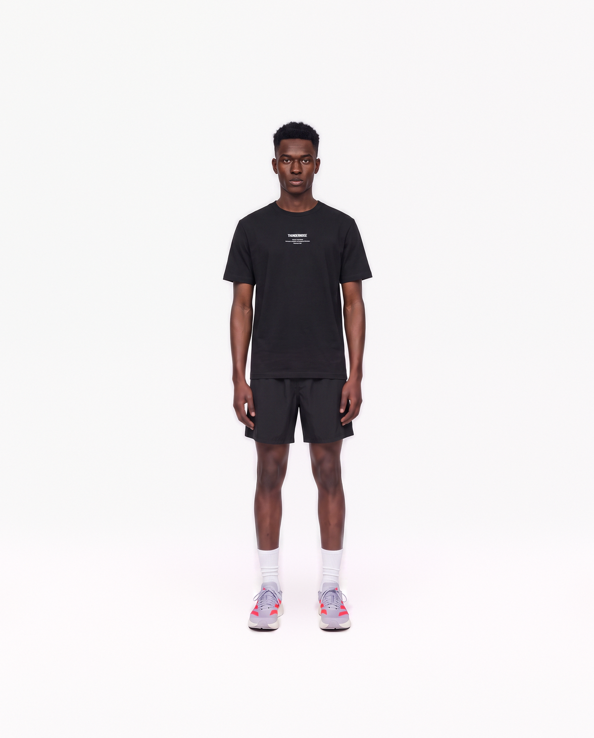 Model wearing the Today Was My Rest Day t-shirt in black — front view with the compact Thundernoise chest mark in white — Vue 2