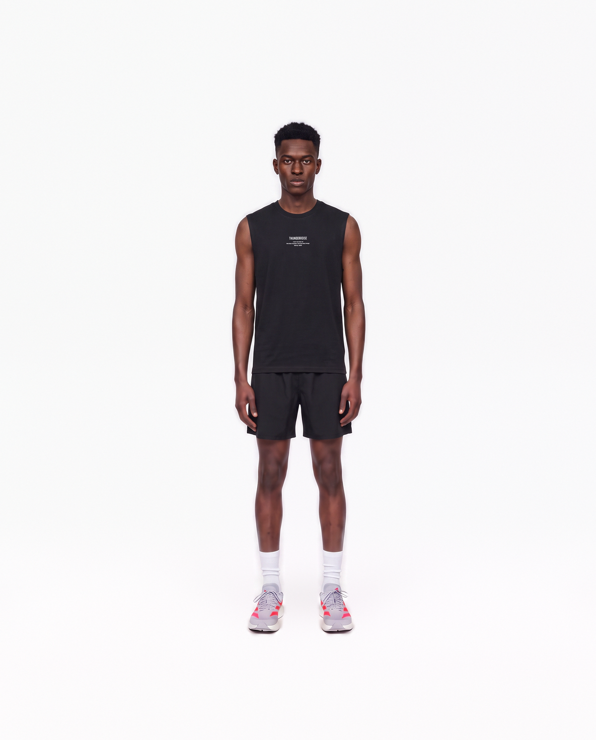 Model wearing the Today Was My Rest Day tank top in black — front view with the compact Thundernoise chest mark in white — Vue 2