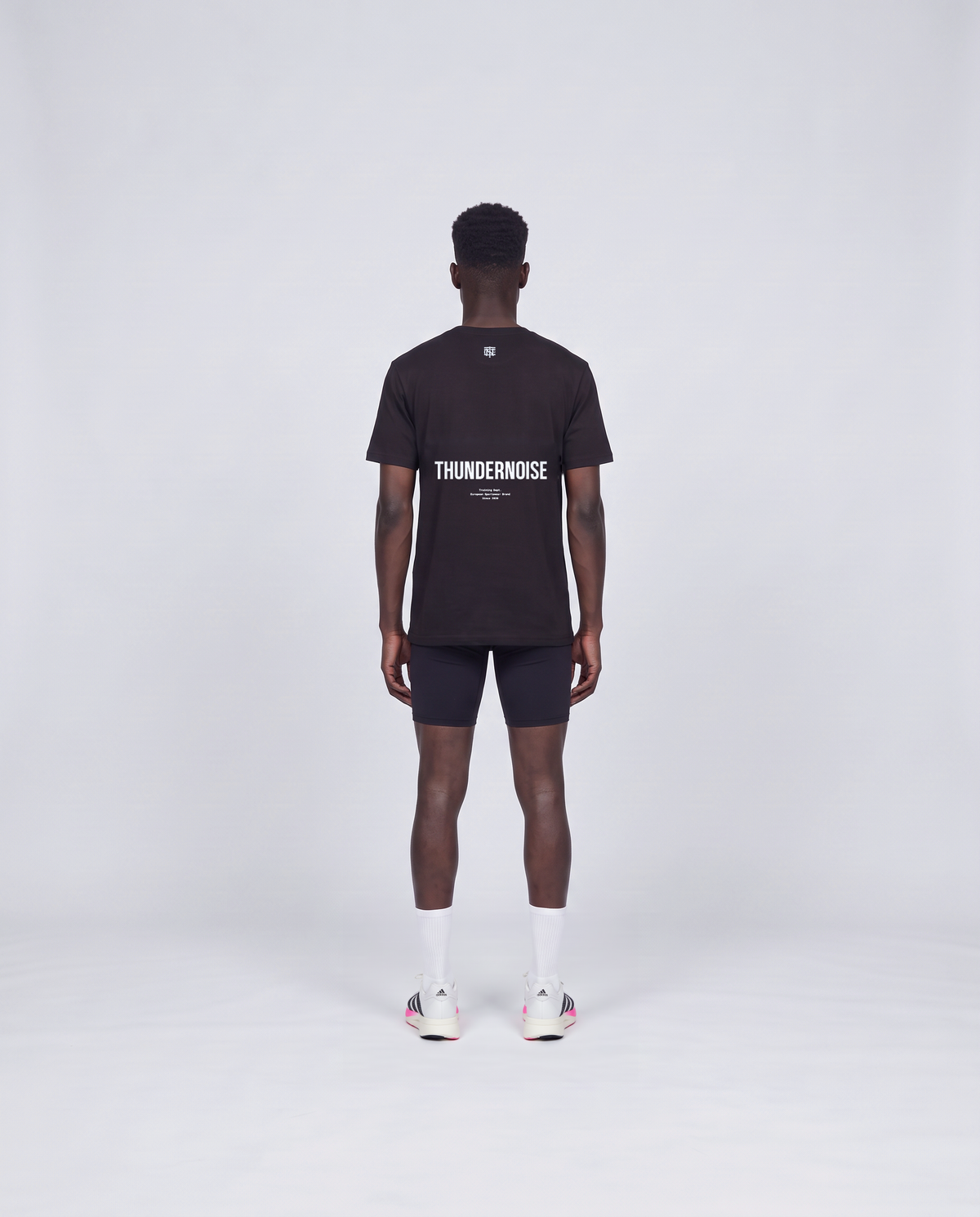 Training Dept. triblend t-shirt in black on model — back view — Vue 4