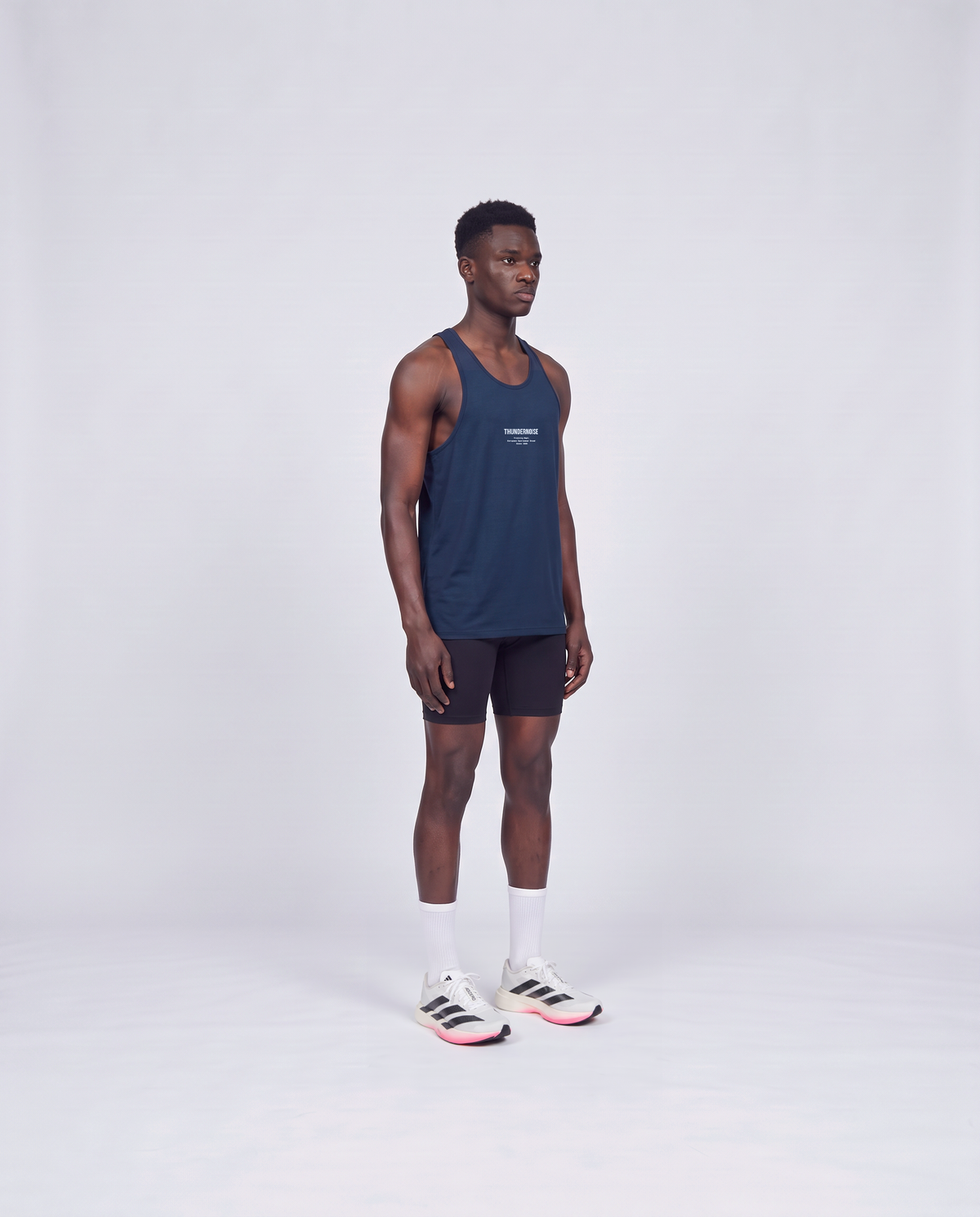 Training Dept. triblend tank top in french navy heather on model — three-quarter view — Vista 3
