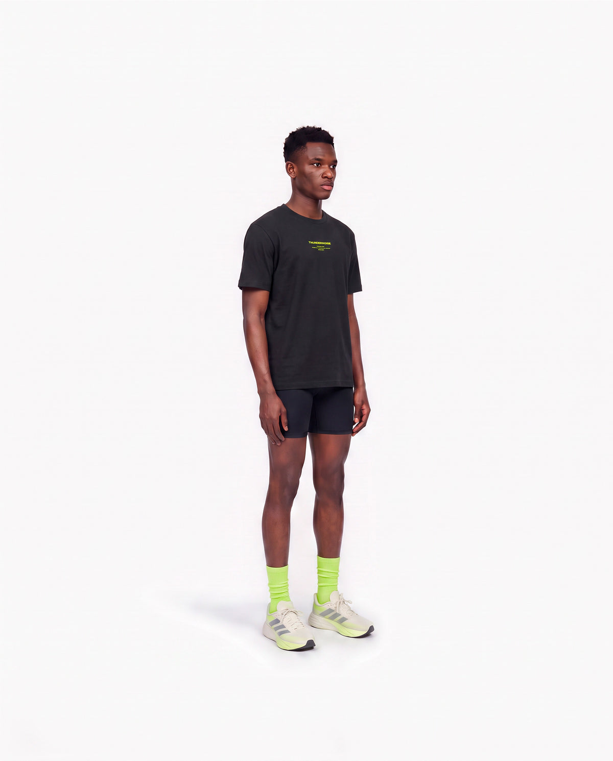 Model wearing the Brick by Brick t-shirt in black — three-quarter view showing the regular fit — Ansicht 3
