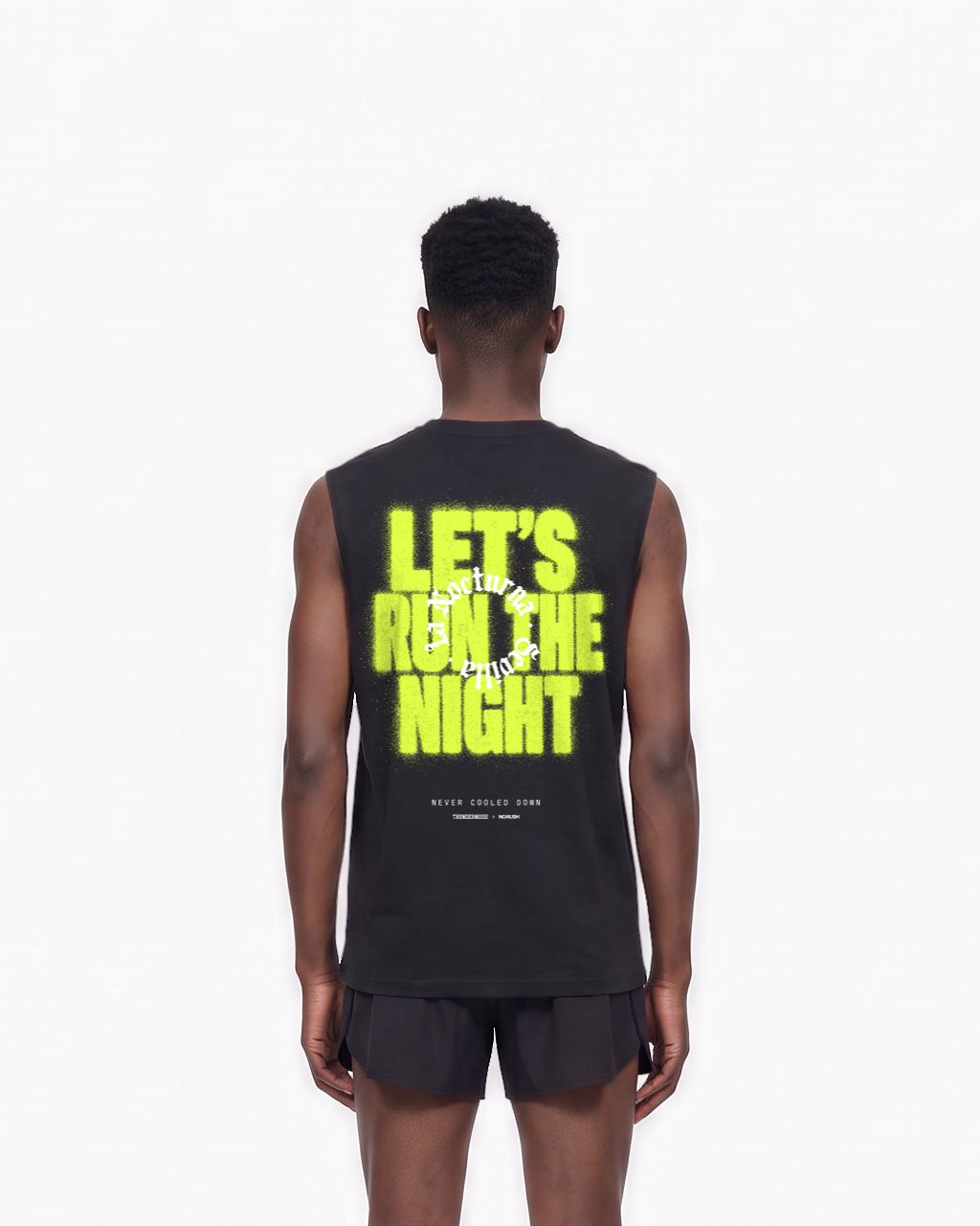 Model wearing the Let's Run the Night tank top in black — back view, close crop on LET'S RUN THE NIGHT sprayed in electric lime around the La Nocturna Sevilla seal — Vista 7
