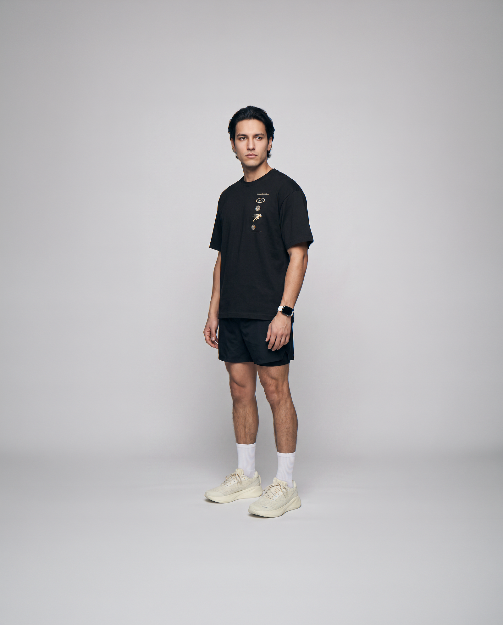 Model wearing the Strong Enough to Run oversize t-shirt in black — three-quarter view showing the oversize fit — Ansicht 2
