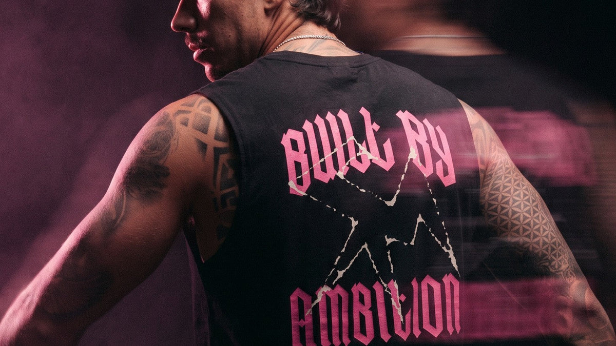 Thundernoise × Sergio Martín: black Tank Top with the pink Built by Ambition back graphic.
