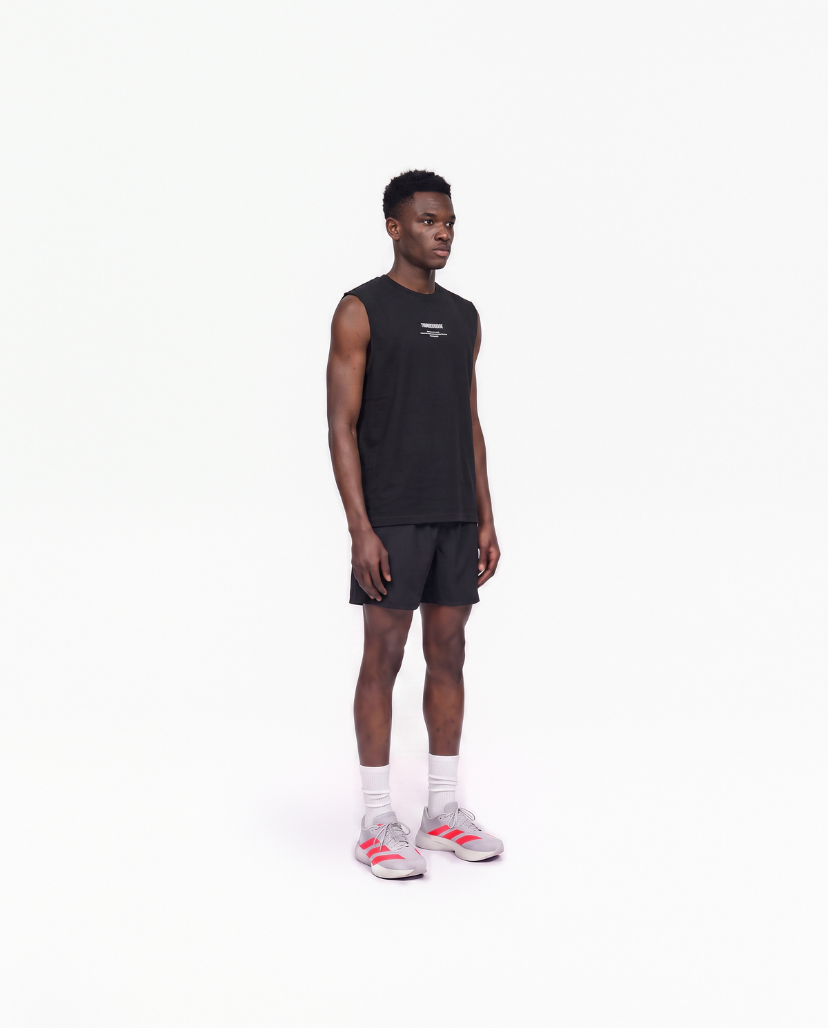Model wearing the Today Was My Rest Day tank top in black — three-quarter view showing the regular fit — Vue 3

