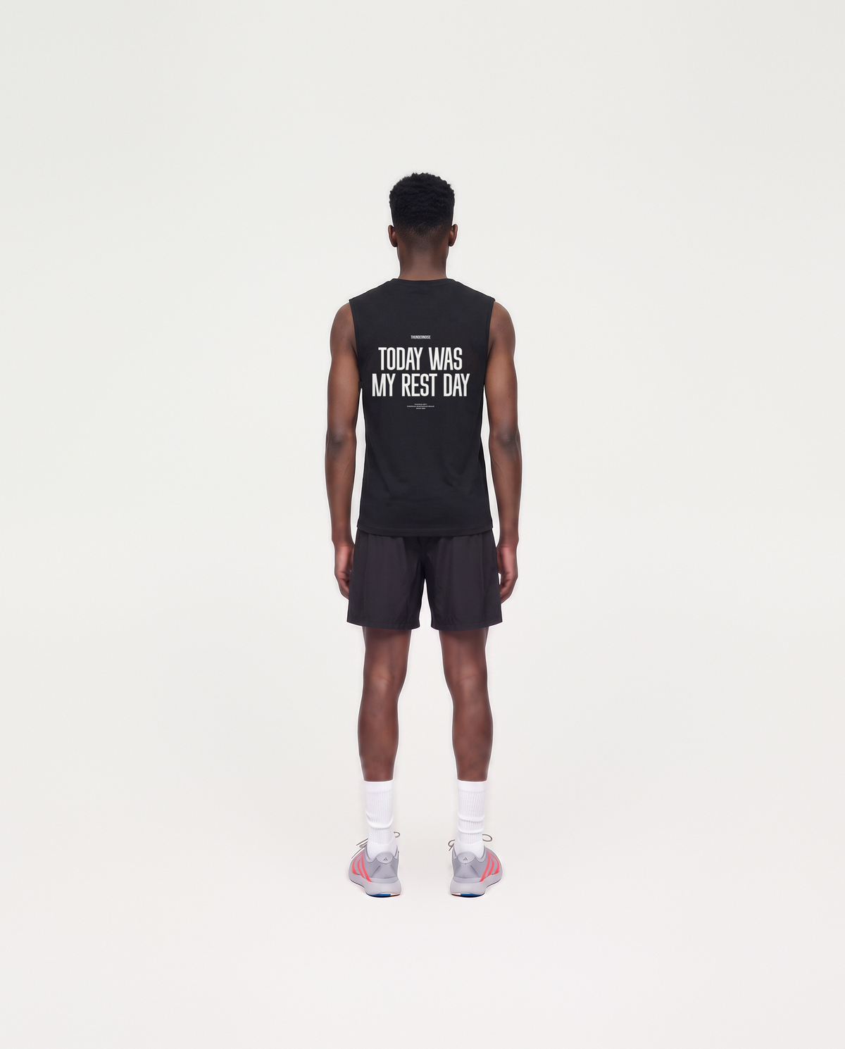 Model wearing the Today Was My Rest Day tank top in black — back view with the TODAY WAS MY REST DAY block in white — Vue 4

