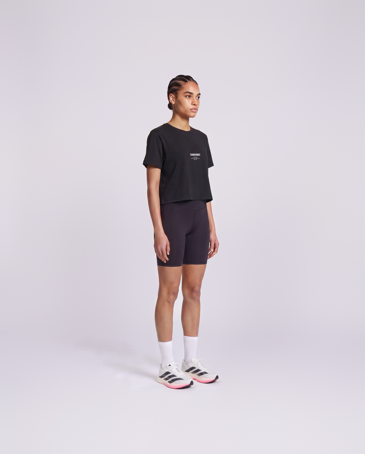 Training Dept. triblend cropped t-shirt in black on model — three-quarter view — Vista 3
