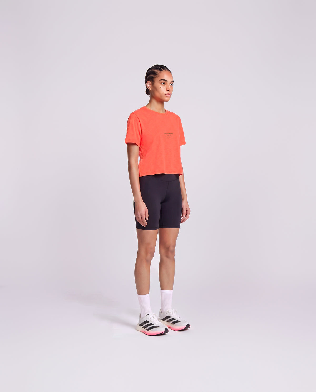 Training Dept. triblend cropped t-shirt in coral on model — three-quarter view — Vista 3
