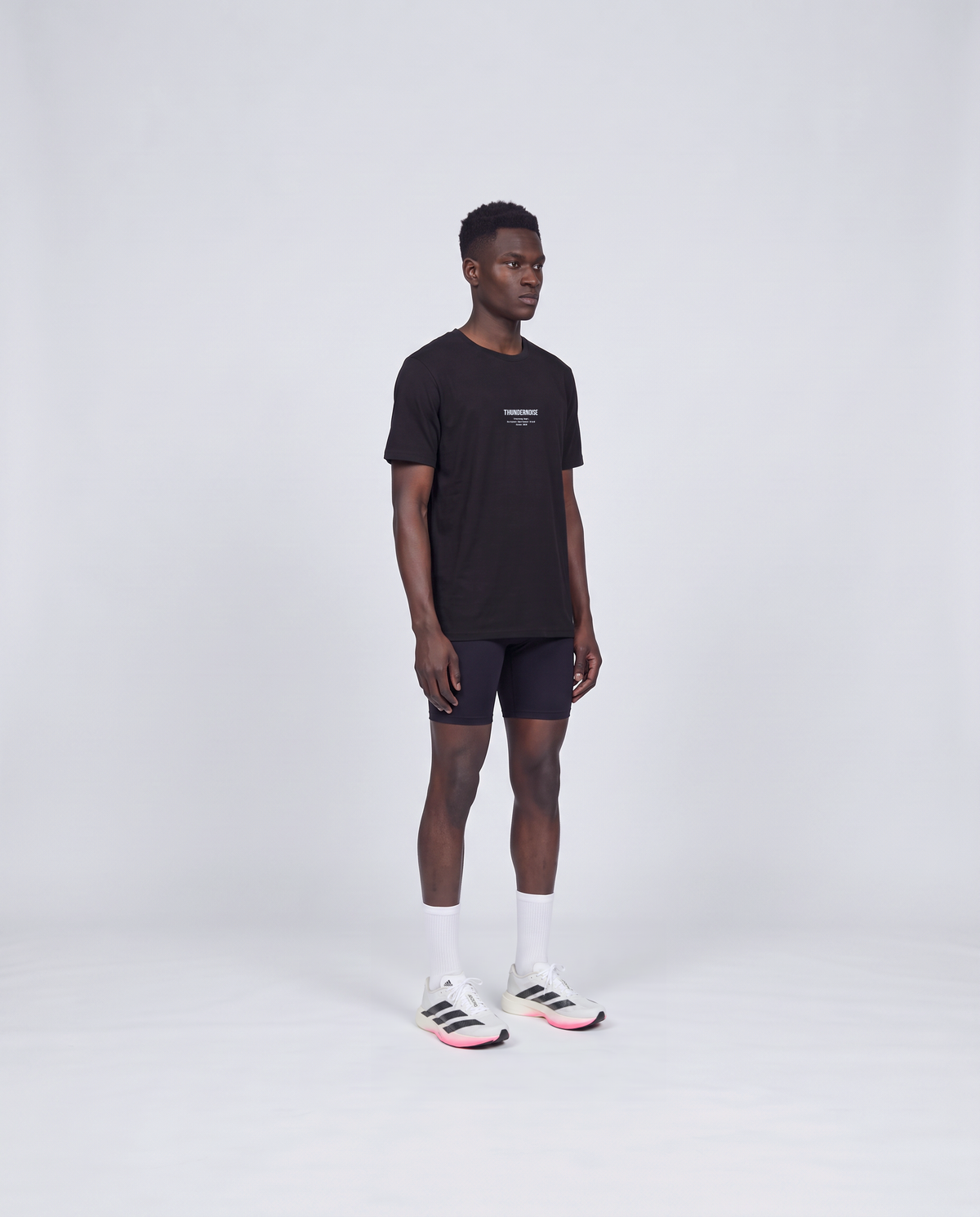 Training Dept. triblend t-shirt in black on model — three-quarter view — Vue 3
