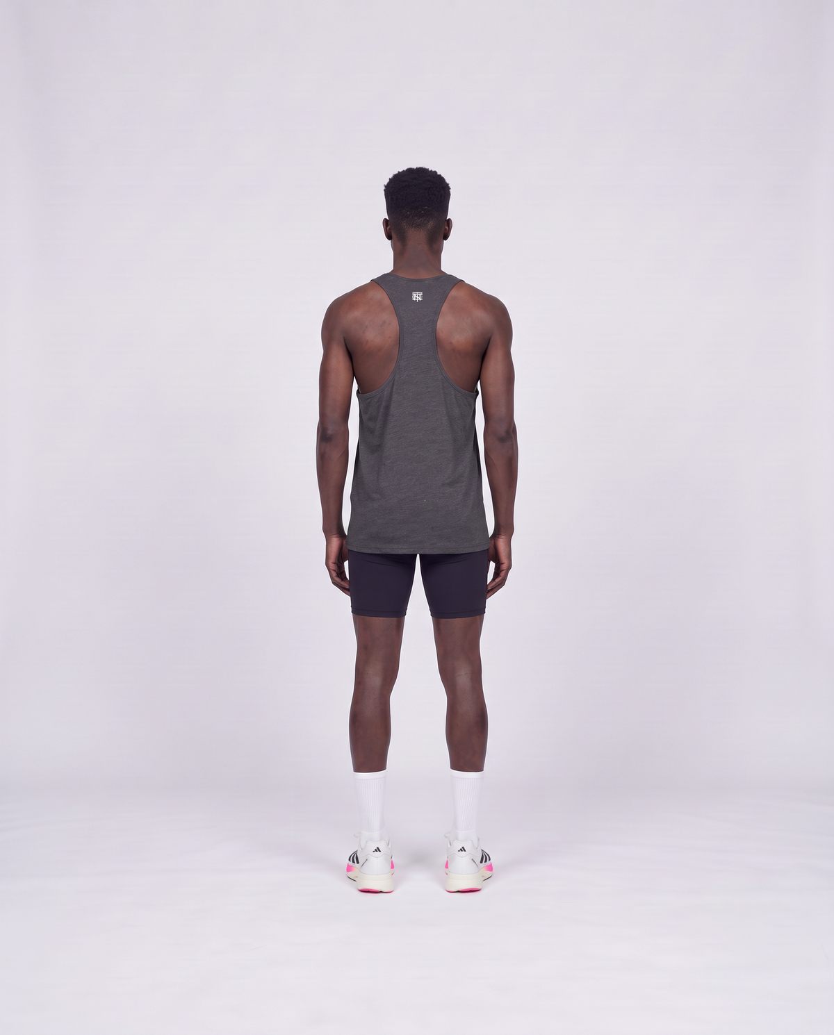 Training Dept. triblend tank top in dark grey heather on model — back view — Vue 4
