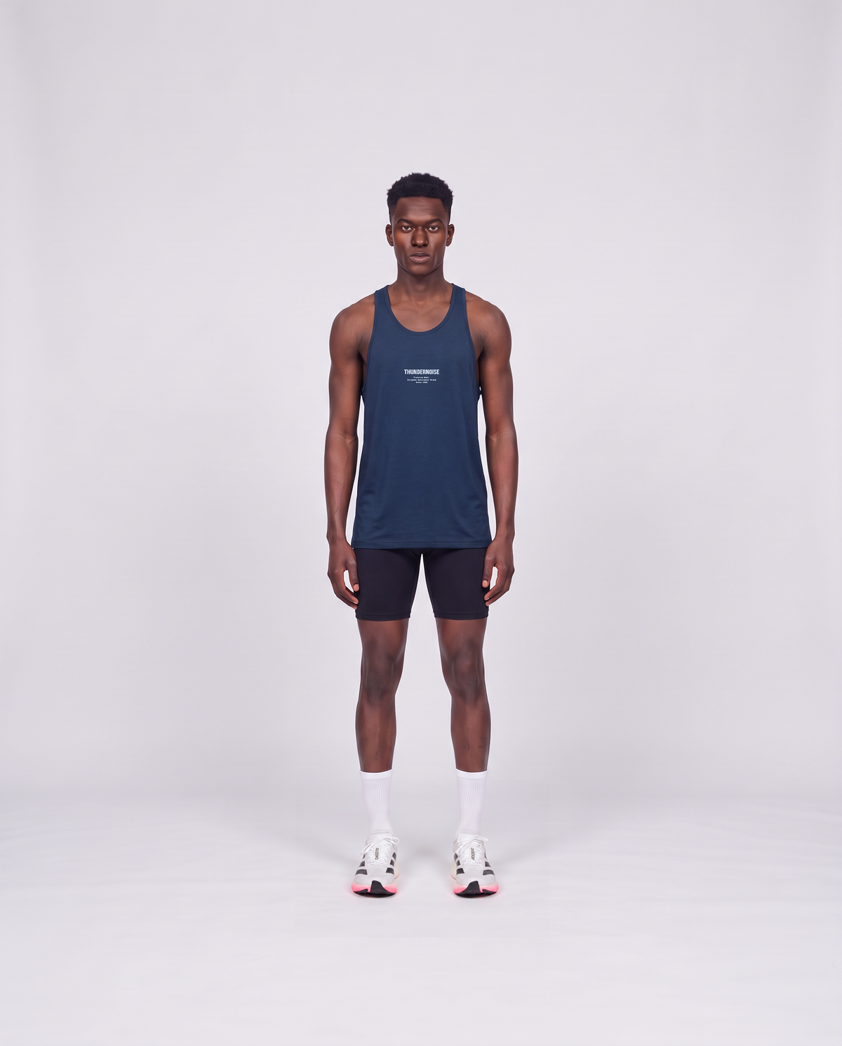 Training Dept. triblend tank top in french navy heather on model — front view — Vista 2
