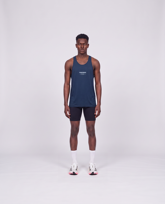 Training Dept. triblend tank top in french navy heather on model — front view